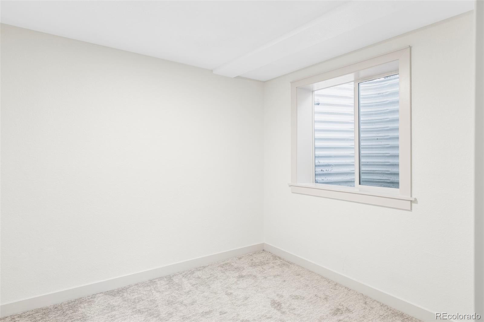 1380 Ithaca Drive Boulder, CO 80305 - Photo 27 of 34 an empty room with a window