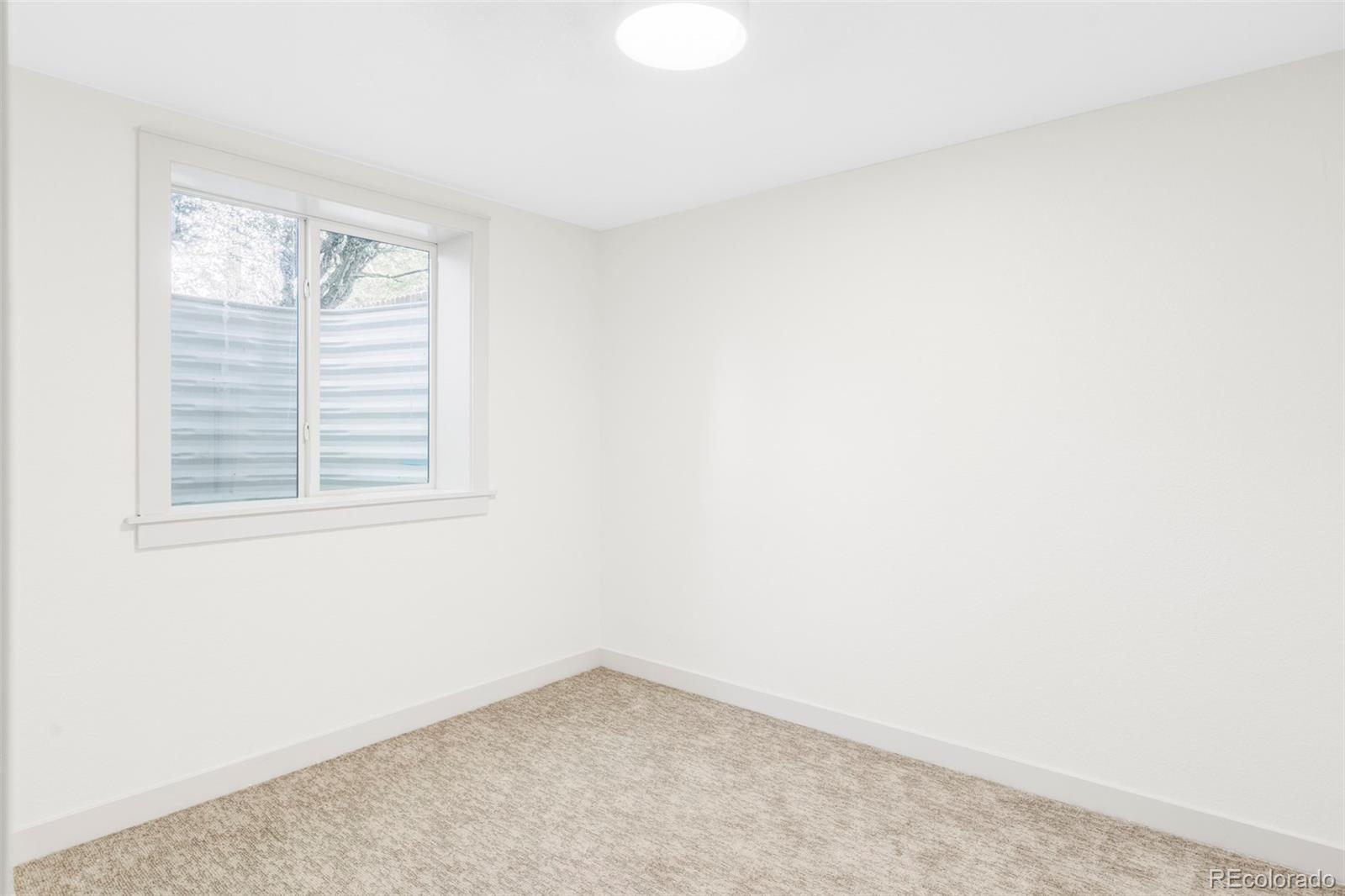 1380 Ithaca Drive Boulder, CO 80305 - Photo 28 of 34 a view of an empty room with a window