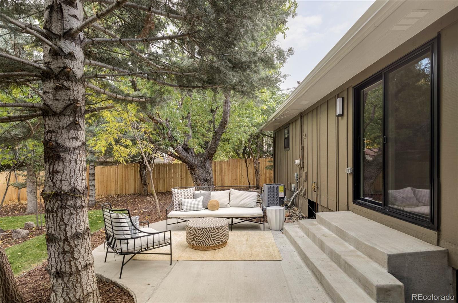 1380 Ithaca Drive Boulder, CO 80305 - Photo 30 of 34 a view of a patio with couches table and chairs and potted plants