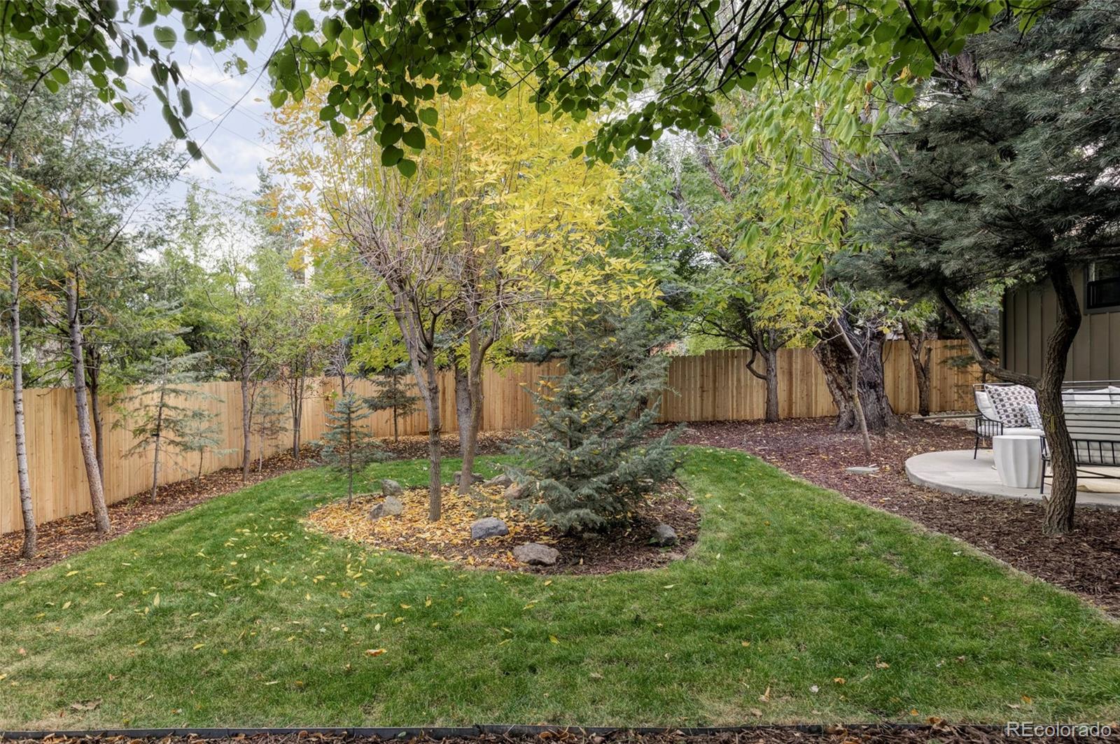 1380 Ithaca Drive Boulder, CO 80305 - Photo 33 of 34 a view of a backyard with large trees