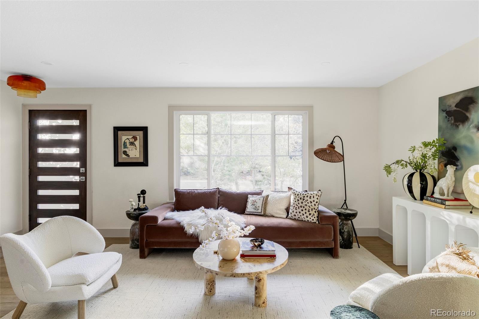 1380 Ithaca Drive Boulder, CO 80305 - Photo 5 of 34 a living room with furniture and a large window