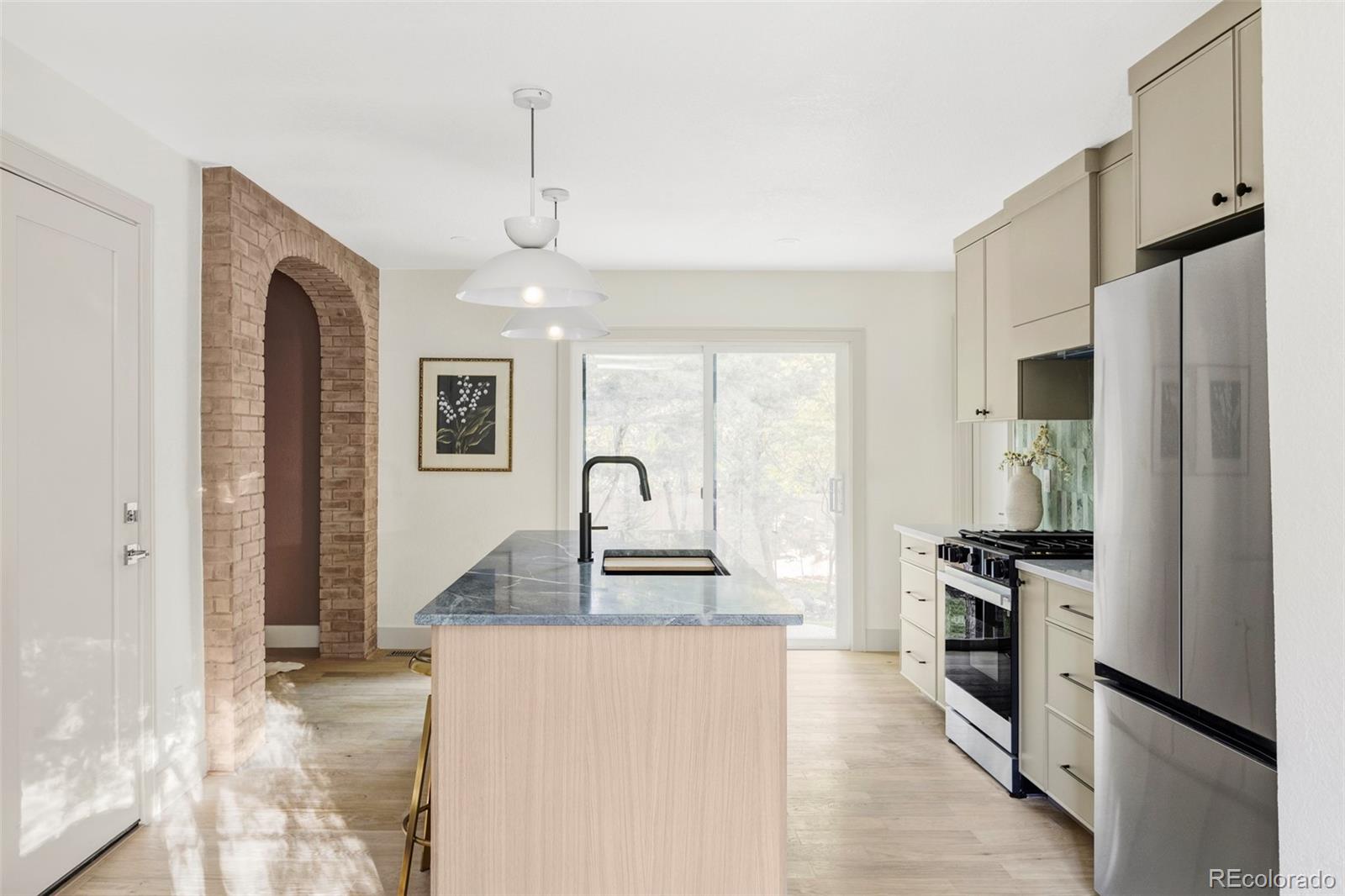 1380 Ithaca Drive Boulder, CO 80305 - Photo 8 of 34 a kitchen with granite countertop a refrigerator stove top oven and sink