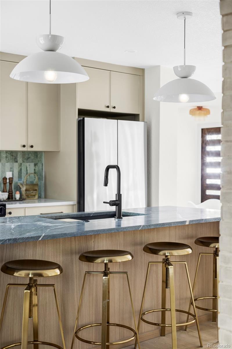 1380 Ithaca Drive Boulder, CO 80305 - Photo 10 of 34 a kitchen with stainless steel appliances granite countertop a sink and a stove