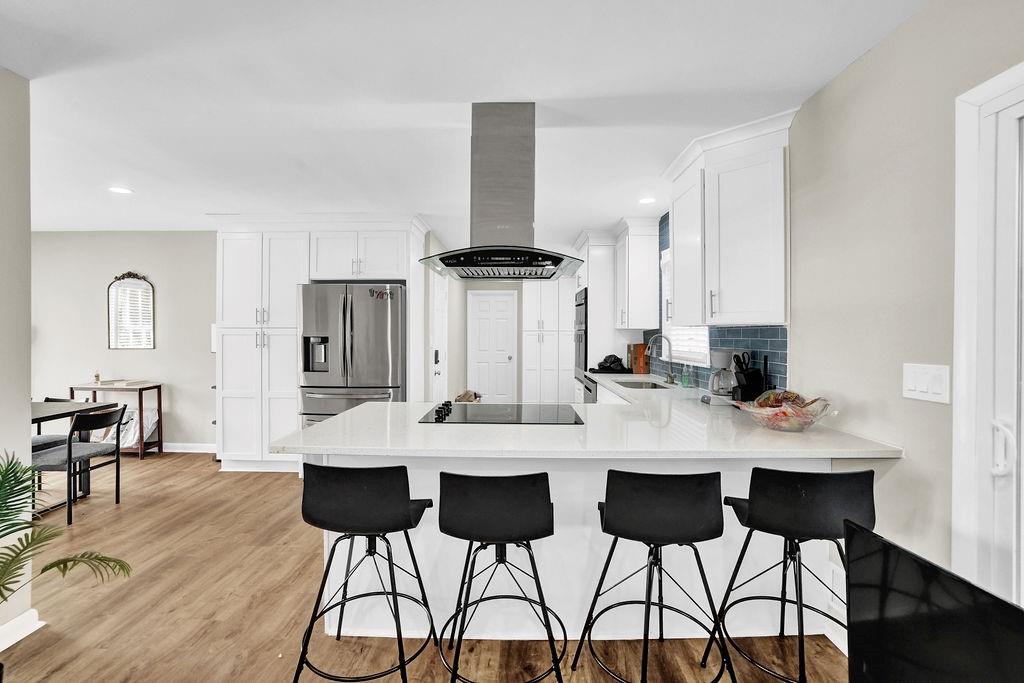 4420 Lavista Road Tucker, GA 30084 - Photo 13 of 36 a view of a dining room with furniture and wooden floor