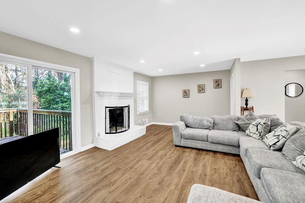 4420 Lavista Road Tucker, GA 30084 - Photo 15 of 36 a living room with furniture and a fireplace