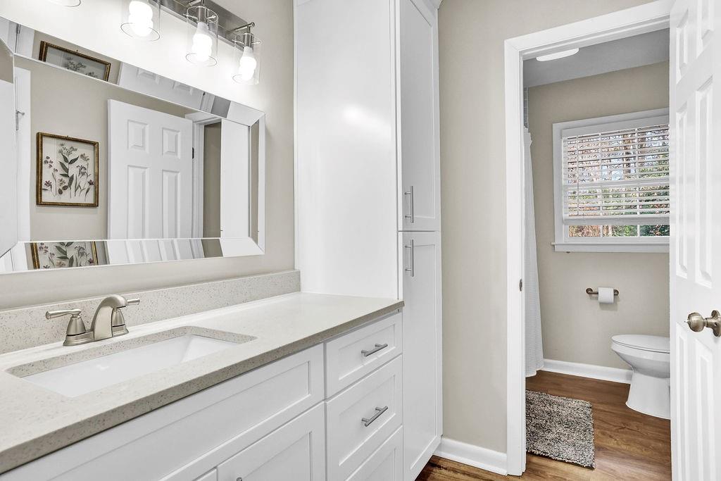 4420 Lavista Road Tucker, GA 30084 - Photo 20 of 36 a bathroom with a sink and a large mirror