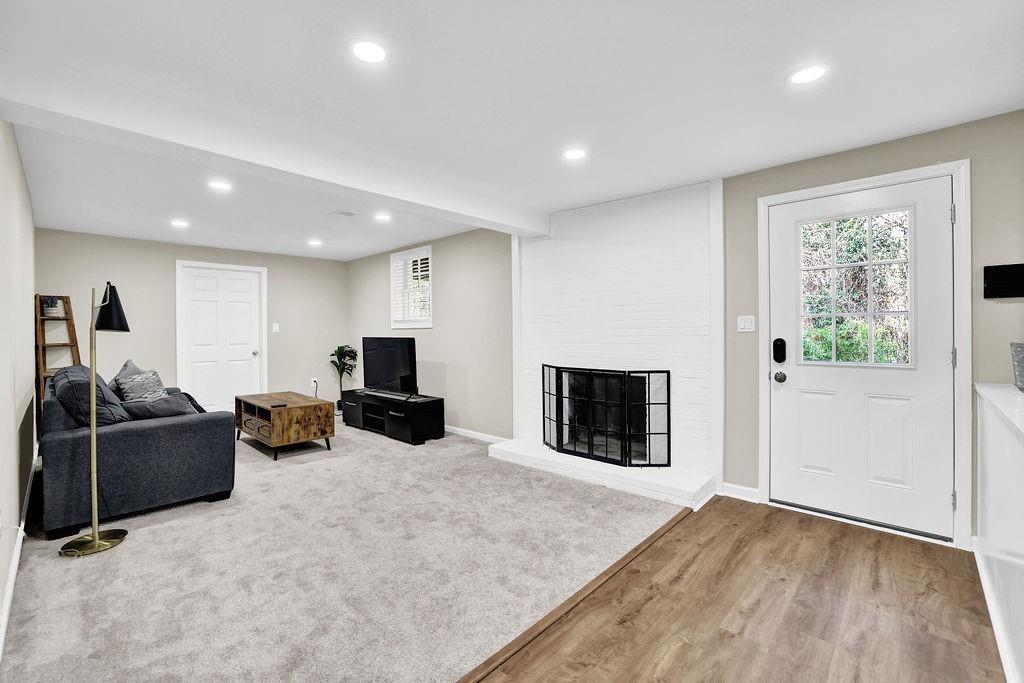 4420 Lavista Road Tucker, GA 30084 - Photo 22 of 36 a living room with furniture and a flat screen tv