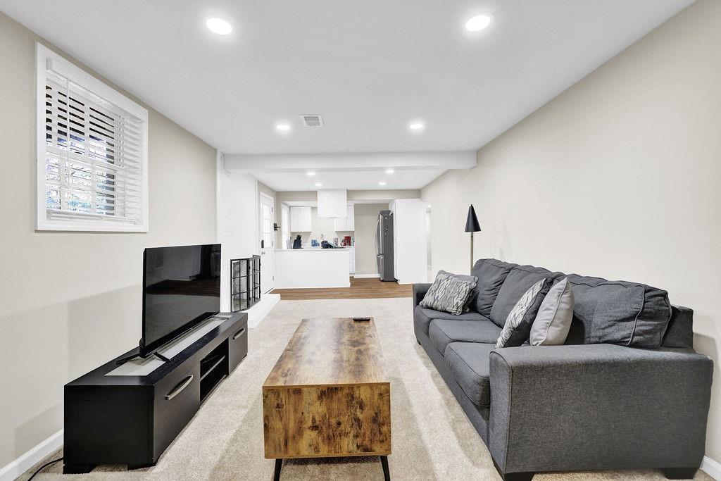 4420 Lavista Road Tucker, GA 30084 - Photo 24 of 36 a living room with furniture and a flat screen tv