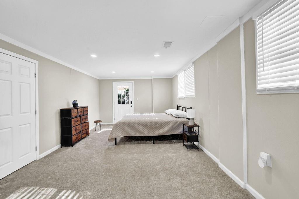 4420 Lavista Road Tucker, GA 30084 - Photo 28 of 36 a spacious bedroom with a bed and a walk in closet