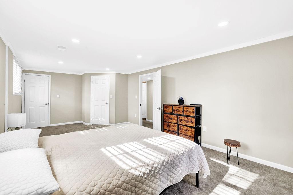 4420 Lavista Road Tucker, GA 30084 - Photo 30 of 36 a bedroom with a bed and a dresser