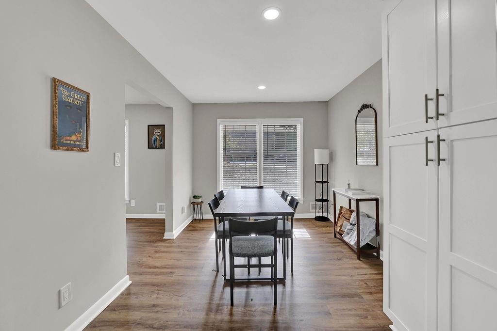 4420 Lavista Road Tucker, GA 30084 - Photo 4 of 36 a dining room with furniture and wooden floor