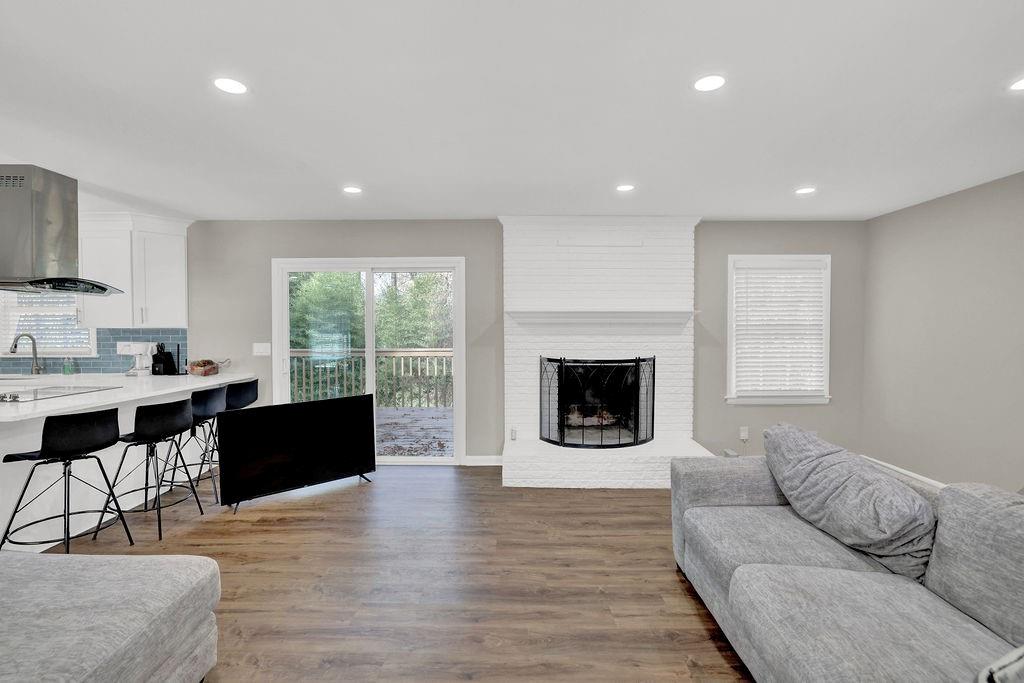 4420 Lavista Road Tucker, GA 30084 - Photo 7 of 36 a living room with furniture and a fireplace