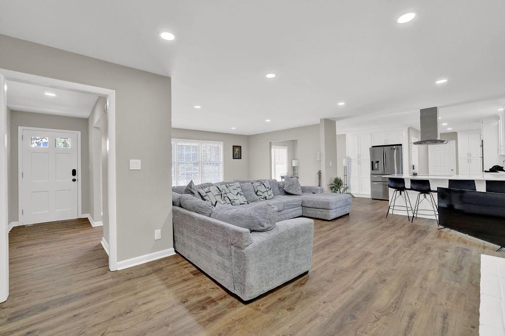 4420 Lavista Road Tucker, GA 30084 - Photo 10 of 36 a living room with furniture and a wooden floor