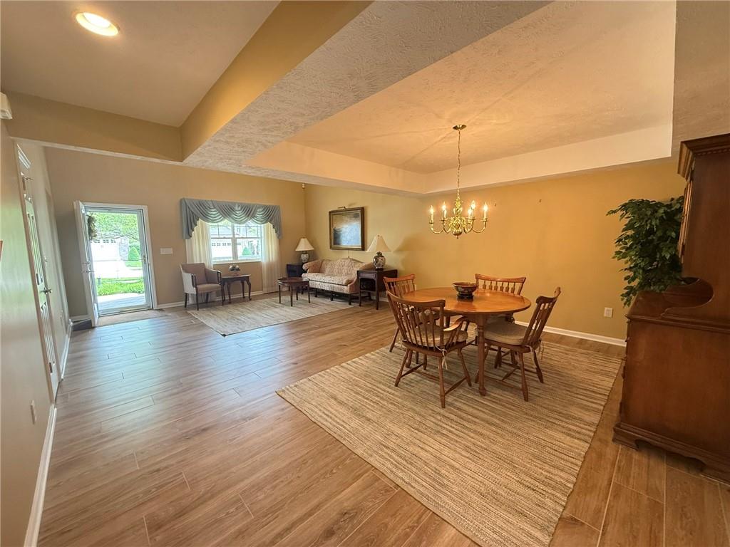 411 Chestnut Lane Apollo, PA 15613 - Photo 2 of 38 a view of a dining room with furniture and wooden floor