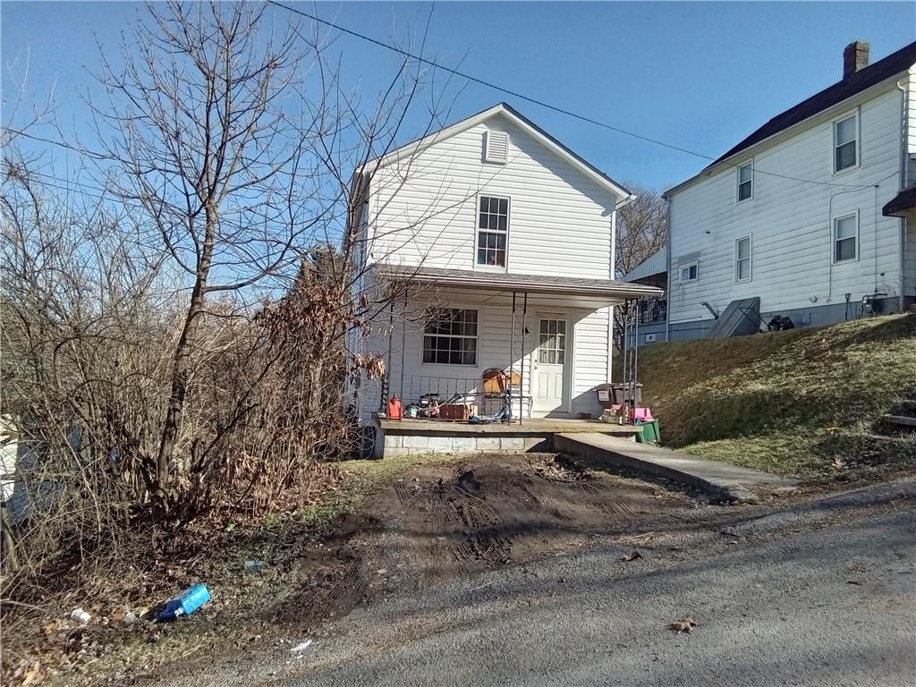 133 Slagle Avenue Butler, PA 16001 - Photo 12 of 14 a front view of a house with yard porch and seating
