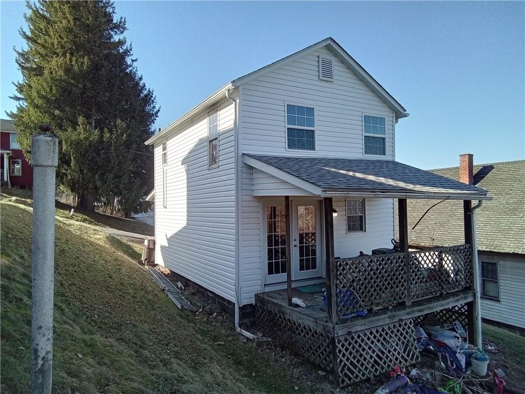 133 Slagle Avenue Butler, PA 16001 - Photo 14 of 14 a view of a house with backyard and trees