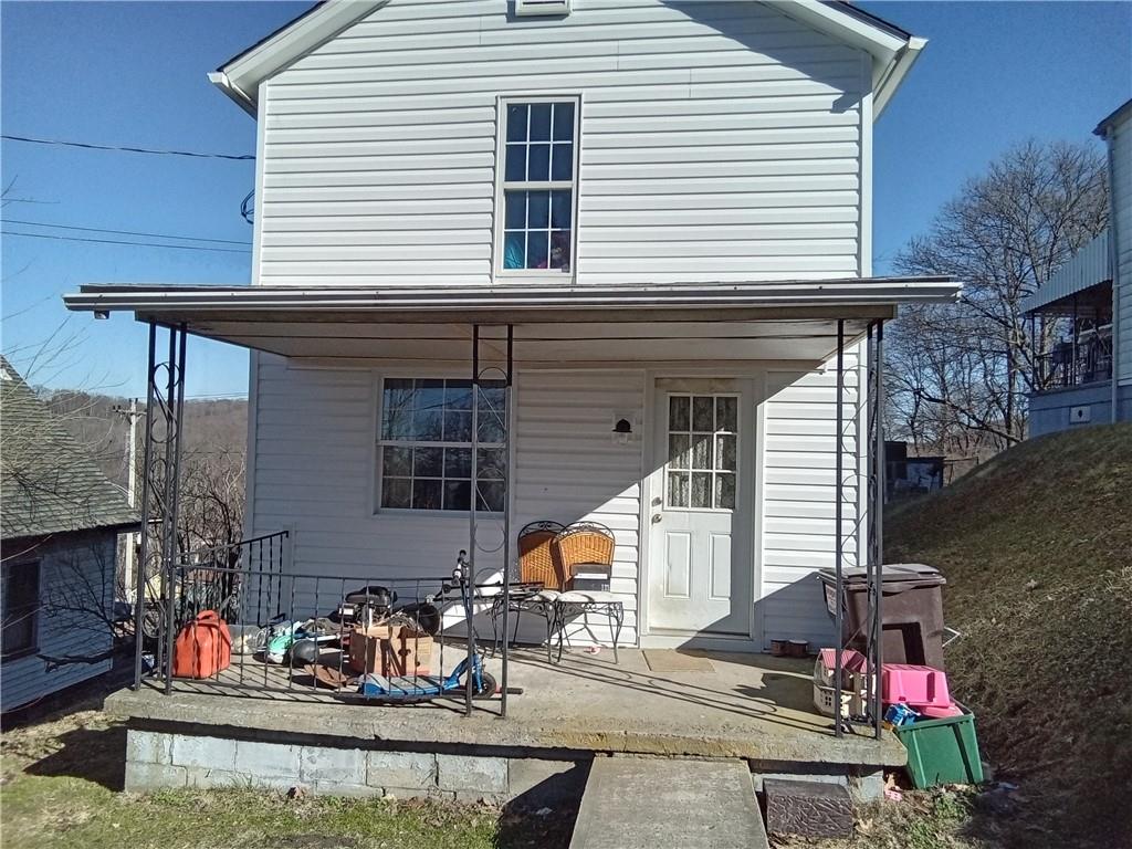 133 Slagle Avenue Butler, PA 16001 - Photo 3 of 14 a backyard of a house with outdoor seating