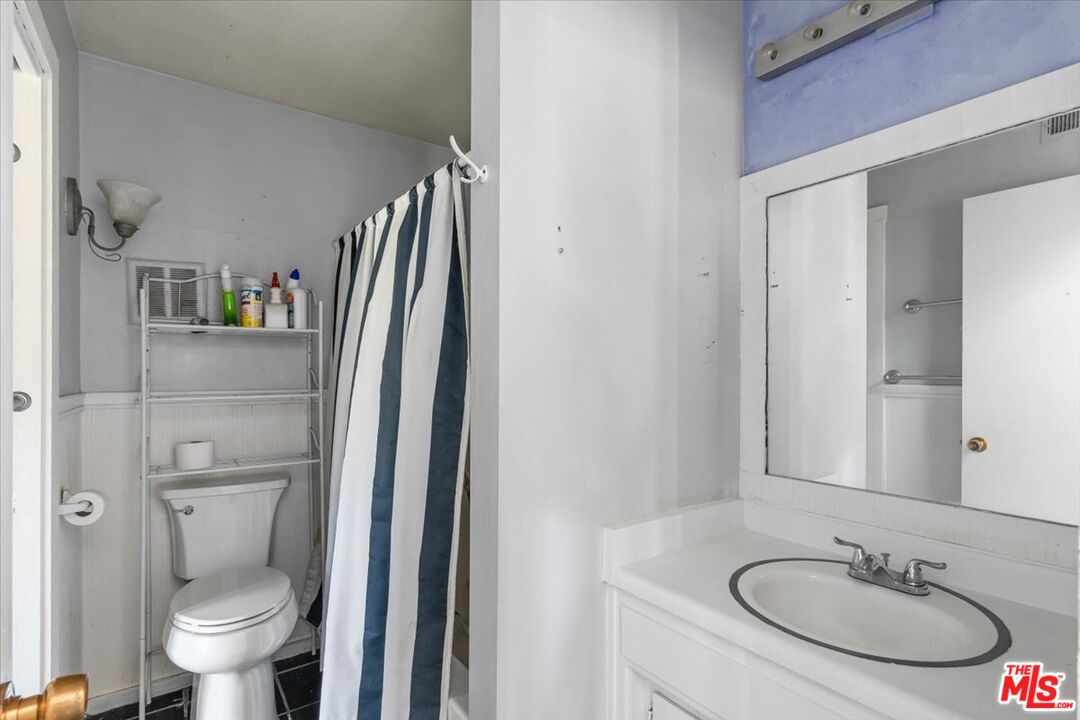 57 Meadow Lakes Drive Tehachapi, CA 93561 - Photo 14 of 26 a bathroom with a sink toilet and shower