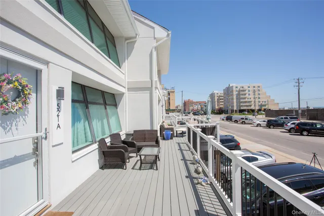 a view of a balcony with chairs