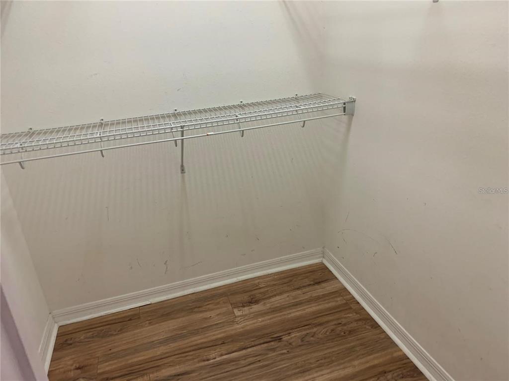 3121 Capri Isle Way Orlando, FL 32835 - Photo 12 of 37 a view of a room with wooden floor