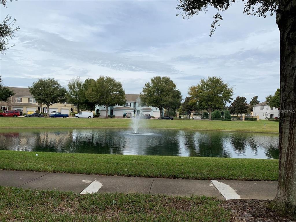 3121 Capri Isle Way Orlando, FL 32835 - Photo 23 of 37 an aerial view of a golf course with a lake view