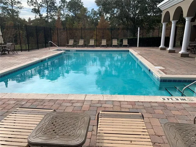 a view of swimming pool with a backyard