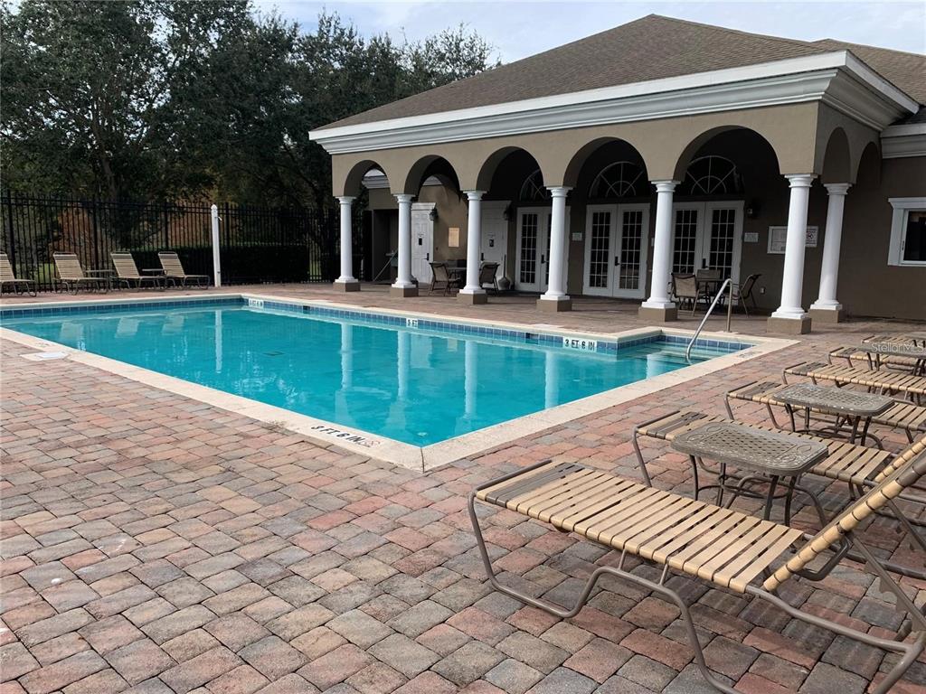 3121 Capri Isle Way Orlando, FL 32835 - Photo 29 of 37 a view of a house with backyard and porch