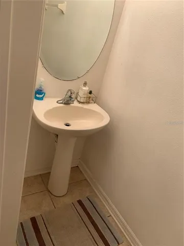 a bathroom with a sink and mirror