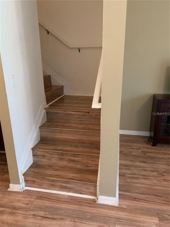 3121 Capri Isle Way Orlando, FL 32835 - Photo 8 of 37 a view of entryway and hall with wooden floor