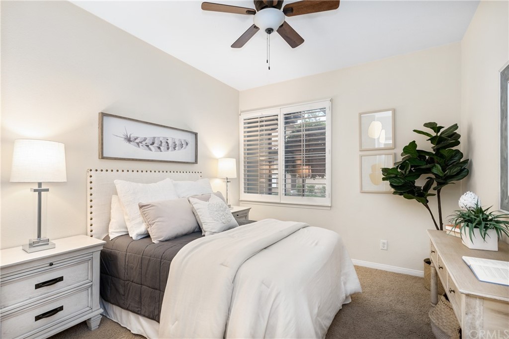 51 Secret Garden Irvine, CA 92620 - Photo 12 of 28 a bedroom with a bed and a potted plant