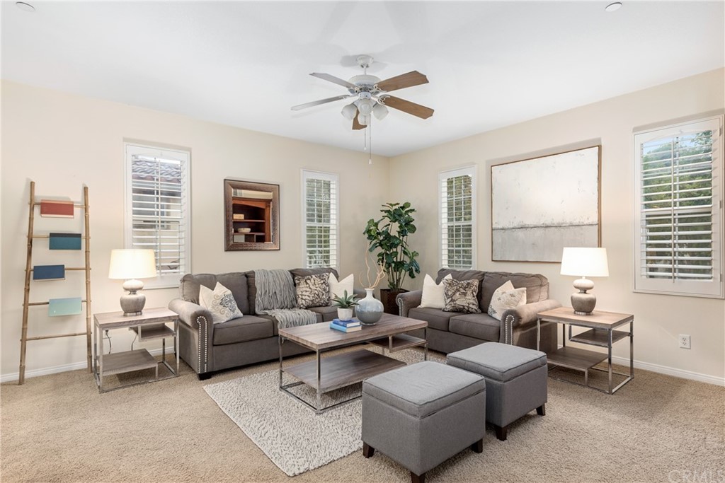 51 Secret Garden Irvine, CA 92620 - Photo 13 of 28 a living room with furniture and a large window