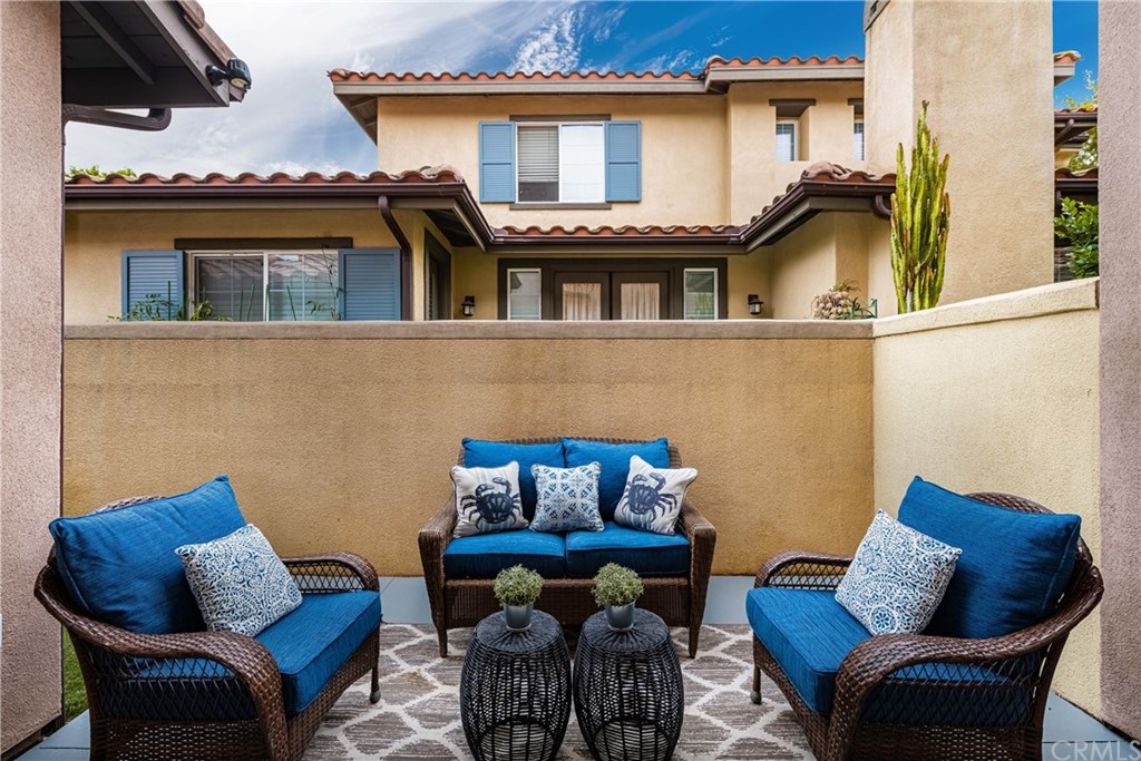 51 Secret Garden Irvine, CA 92620 - Photo 17 of 28 a view of a chair and table in the balcony