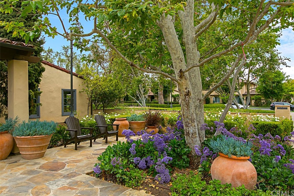 51 Secret Garden Irvine, CA 92620 - Photo 21 of 28 a backyard of a house with lots of green space and fountain