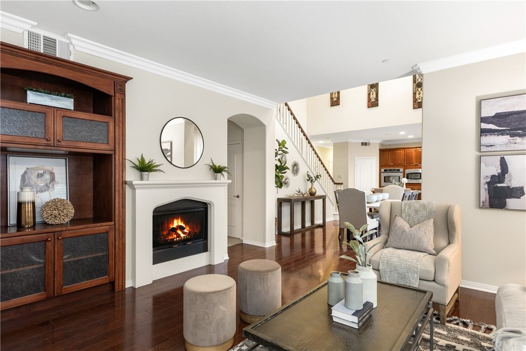 51 Secret Garden Irvine, CA 92620 - Photo 5 of 28 a living room with furniture and a fireplace