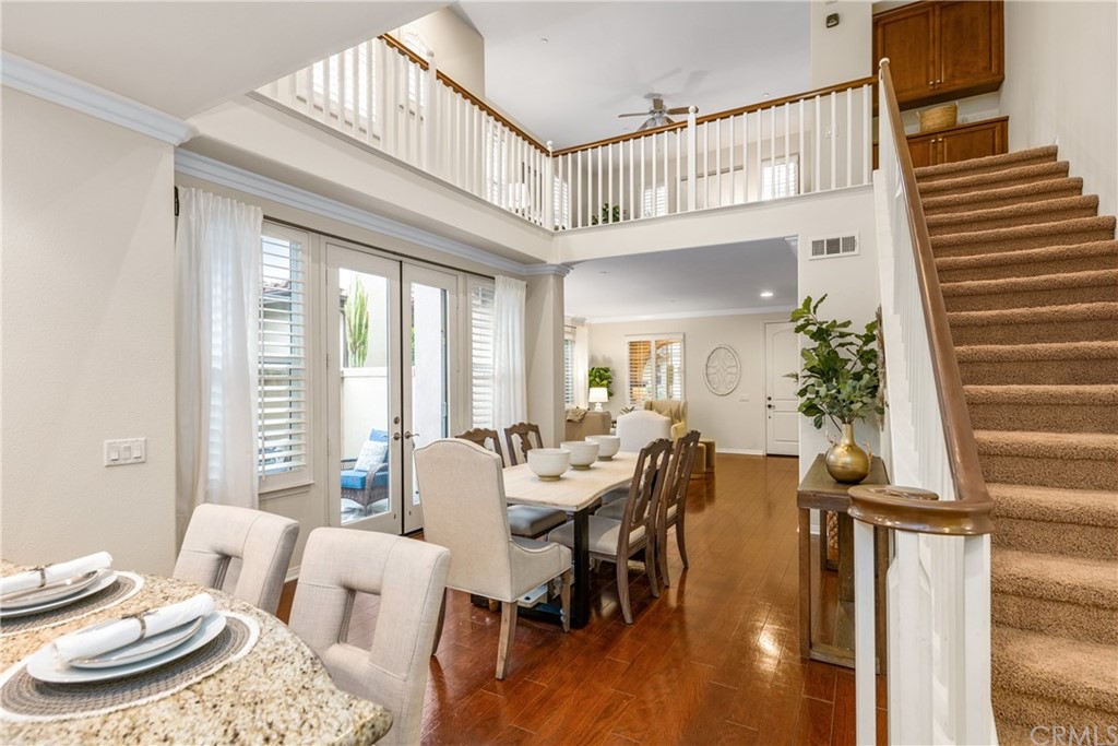 51 Secret Garden Irvine, CA 92620 - Photo 8 of 28 a view of a dining room with furniture window and wooden floor