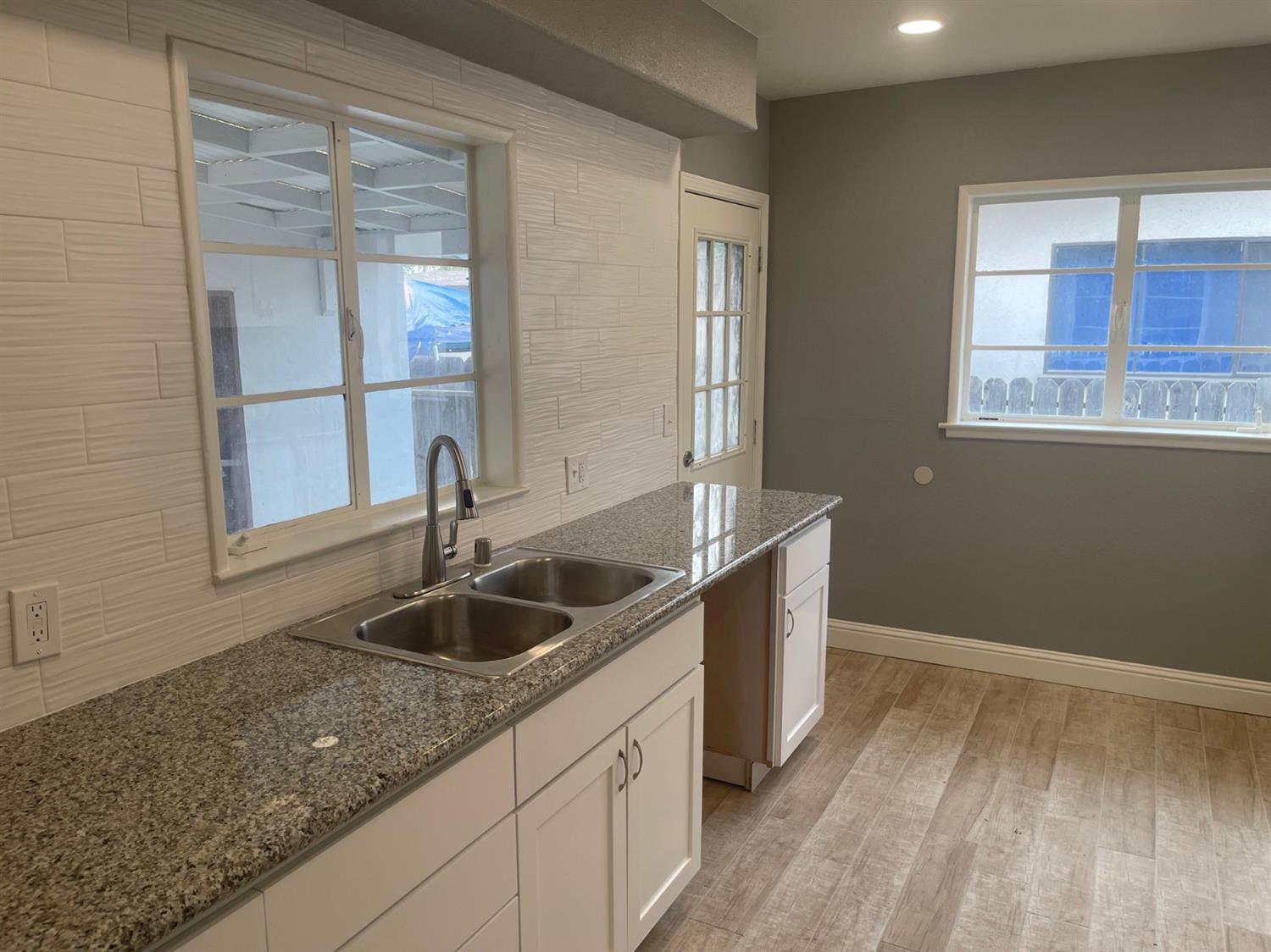 1246 South Klein Avenue Reedley, CA 93654 - Photo 5 of 10 a kitchen with a sink and large window