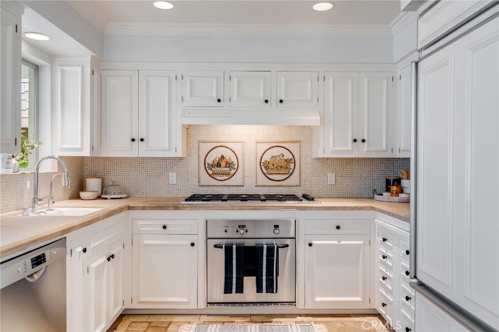 360 Diamond Street Laguna Beach, CA 92651 - Photo 11 of 36 a stove top oven sitting inside of a kitchen