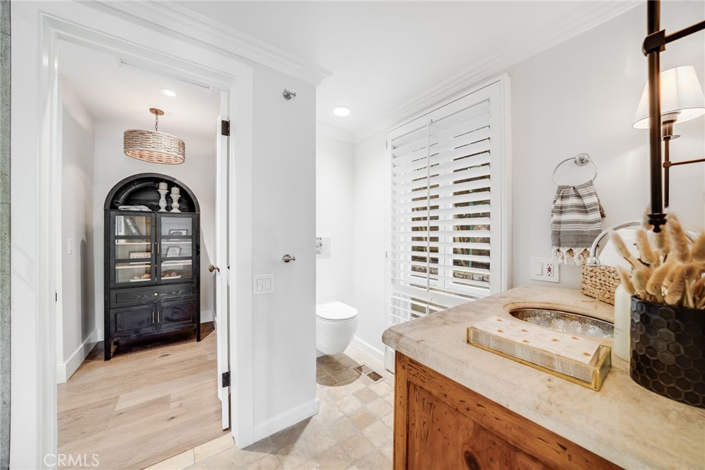 360 Diamond Street Laguna Beach, CA 92651 - Photo 13 of 36 a view of a bathroom with a sink and a washer