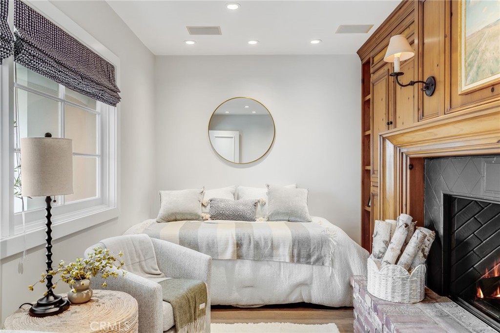 360 Diamond Street Laguna Beach, CA 92651 - Photo 18 of 36 a living room with furniture and a fireplace