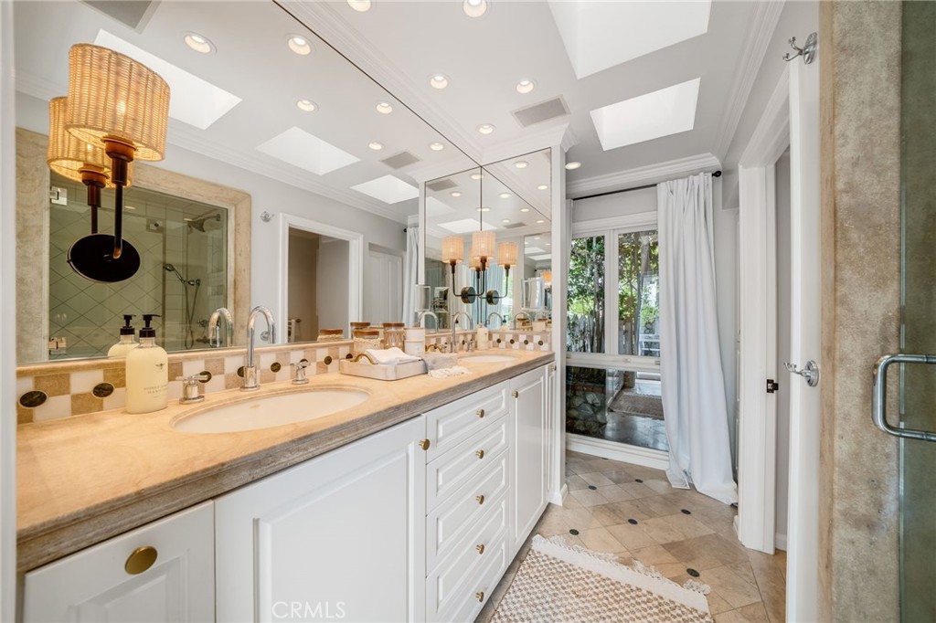 360 Diamond Street Laguna Beach, CA 92651 - Photo 22 of 36 a bathroom with a sink vanity and a mirror