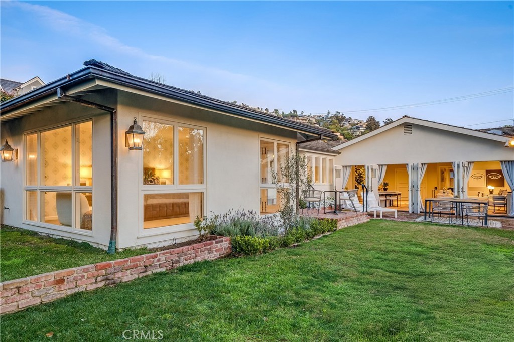 360 Diamond Street Laguna Beach, CA 92651 - Photo 30 of 36 a front view of a house with a garden and yard