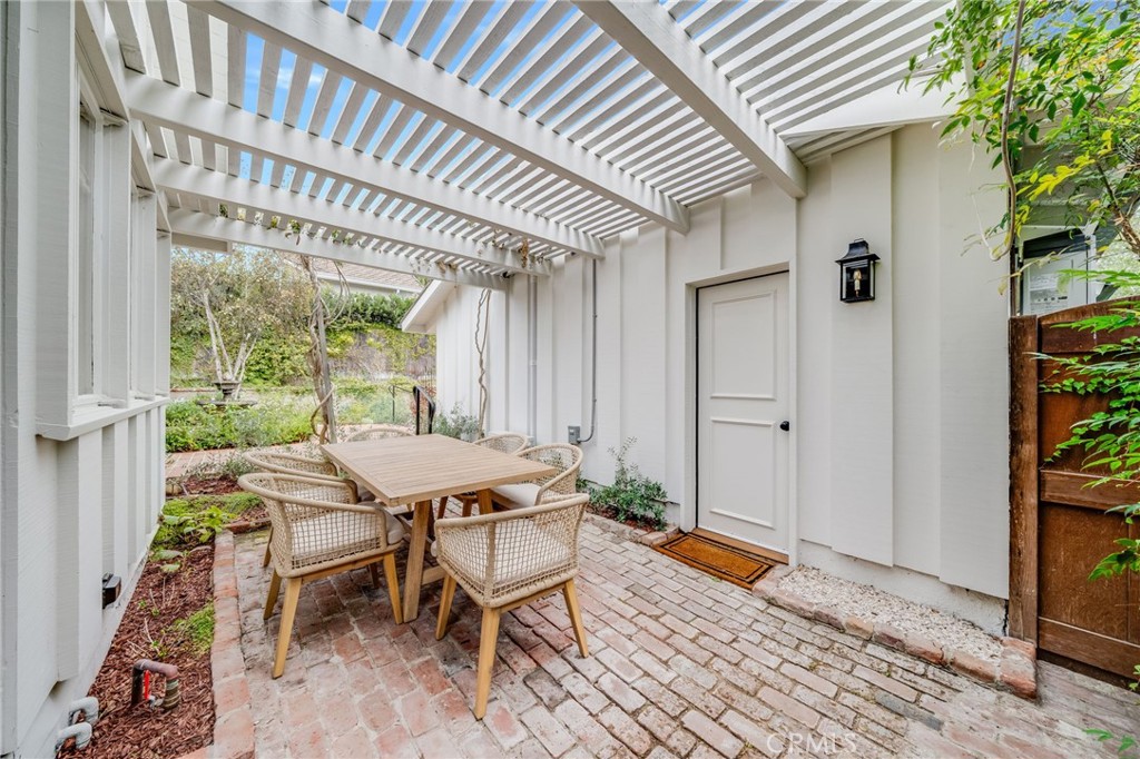 360 Diamond Street Laguna Beach, CA 92651 - Photo 33 of 36 a patio with table and chairs and potted plants