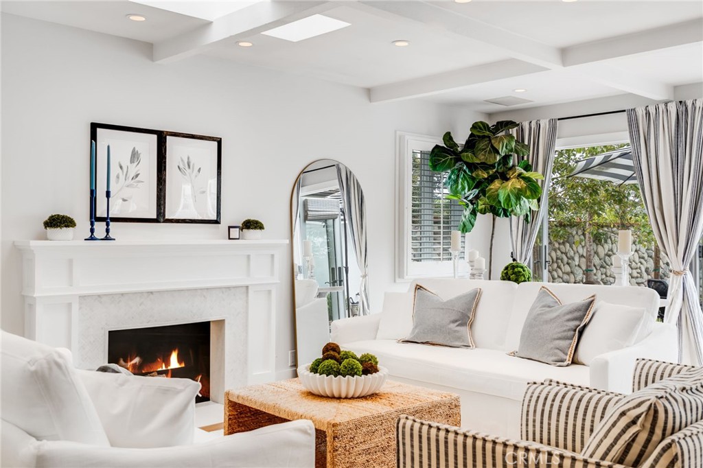360 Diamond Street Laguna Beach, CA 92651 - Photo 7 of 36 a living room with furniture and a fireplace