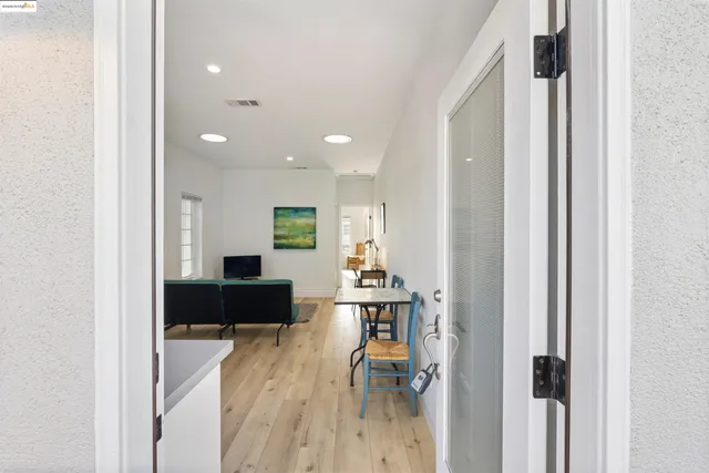 a view of a balcony with wooden floor and fence