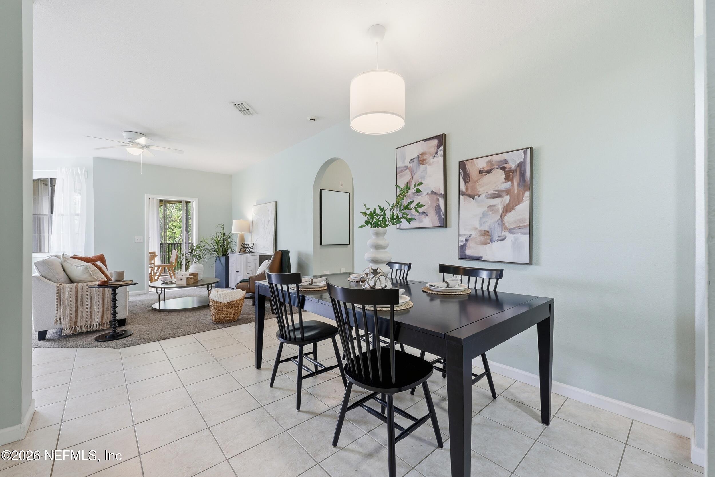 1529 Vista Cove Road St. Augustine, FL 32084 - Photo 11 of 75 a view of a dining room with furniture and a chandelier