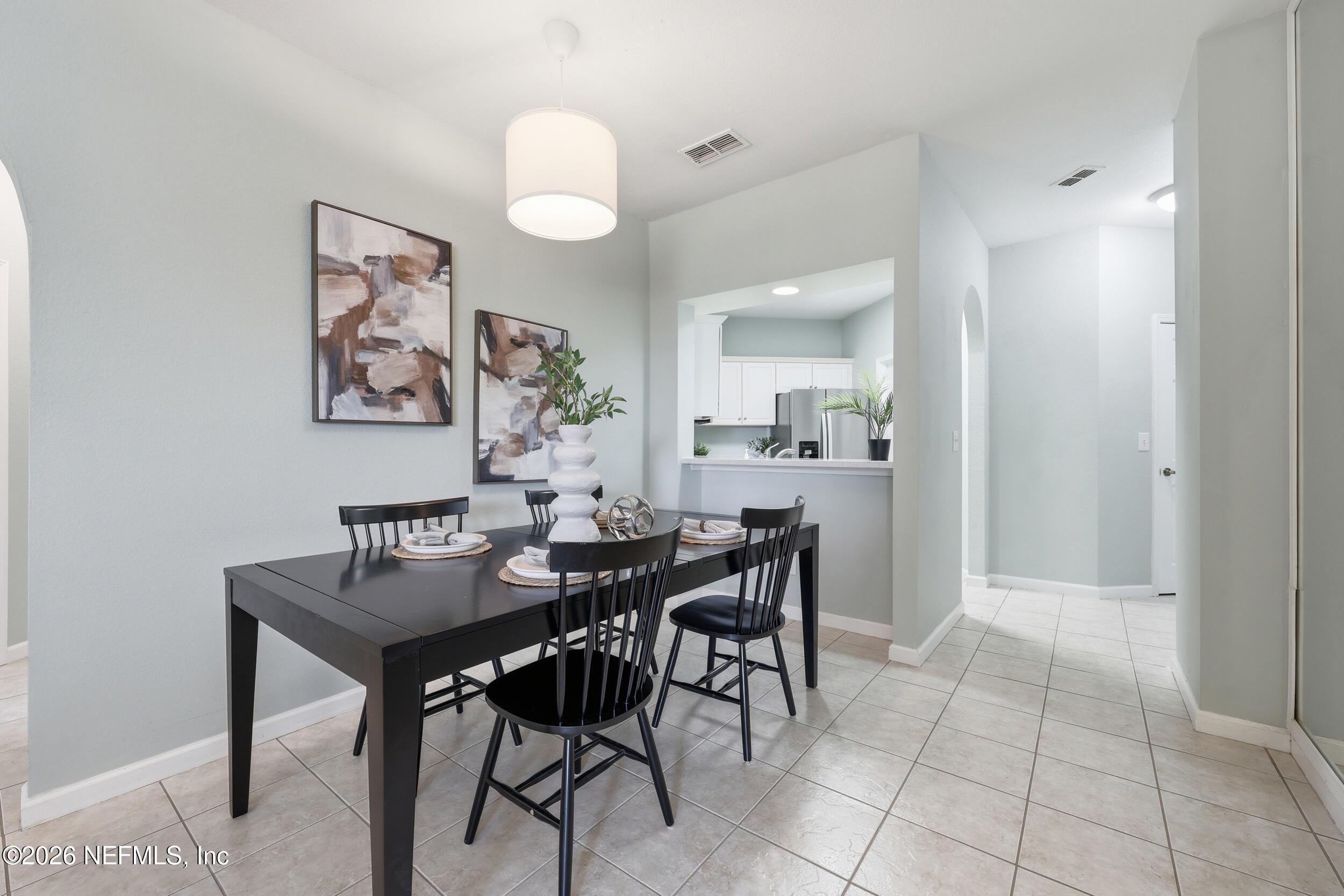 1529 Vista Cove Road St. Augustine, FL 32084 - Photo 13 of 75 a view of a dining room with furniture