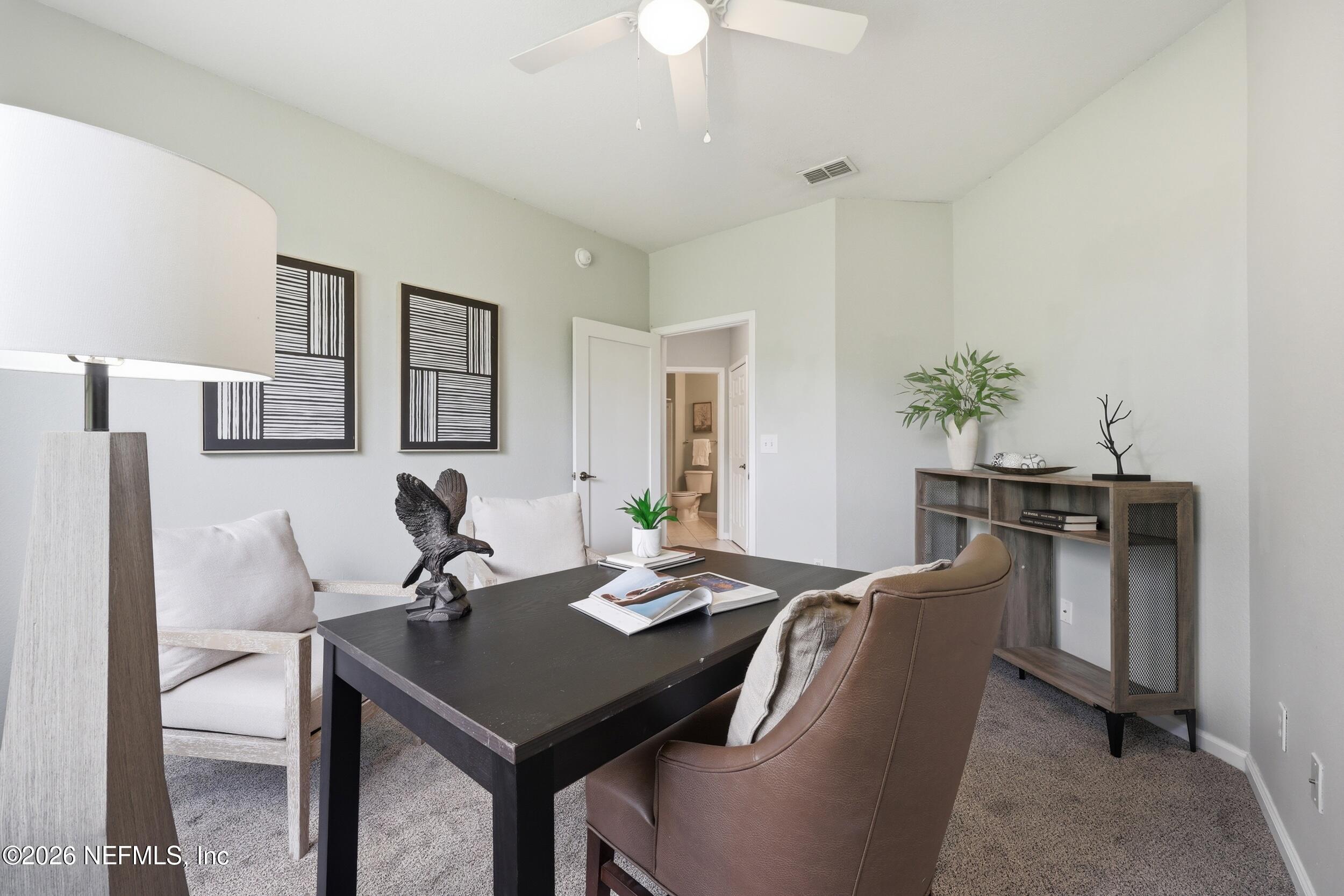 1529 Vista Cove Road St. Augustine, FL 32084 - Photo 29 of 75 a view of a dining room with furniture