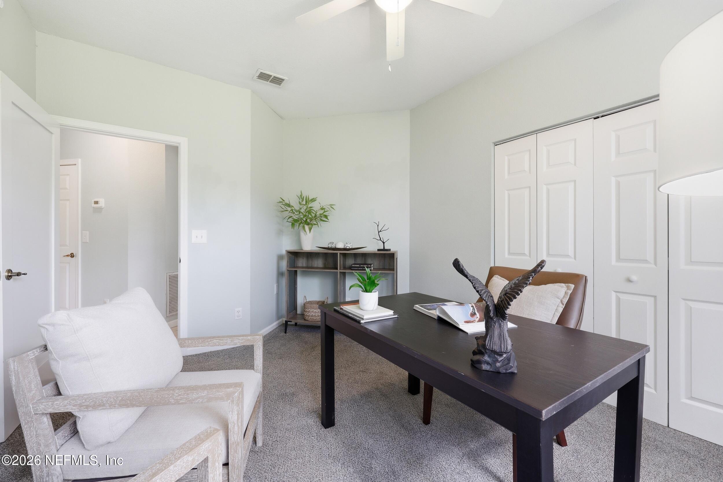1529 Vista Cove Road St. Augustine, FL 32084 - Photo 30 of 75 a view of a workspace with a table and chairs