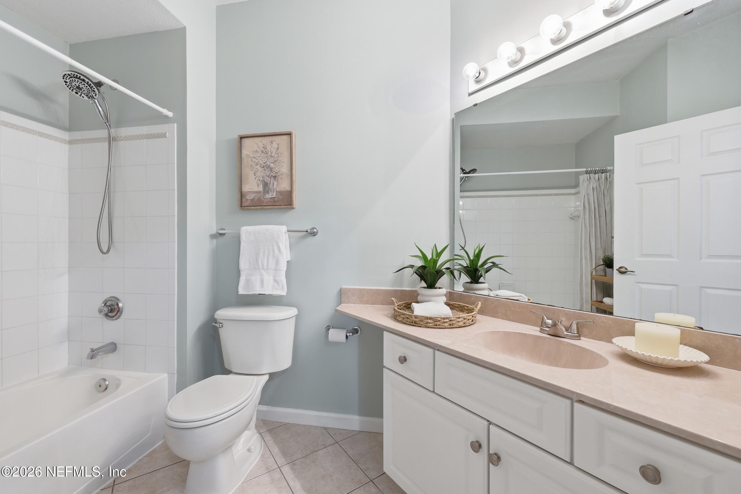 1529 Vista Cove Road St. Augustine, FL 32084 - Photo 31 of 75 a bathroom with a sink a toilet and shower