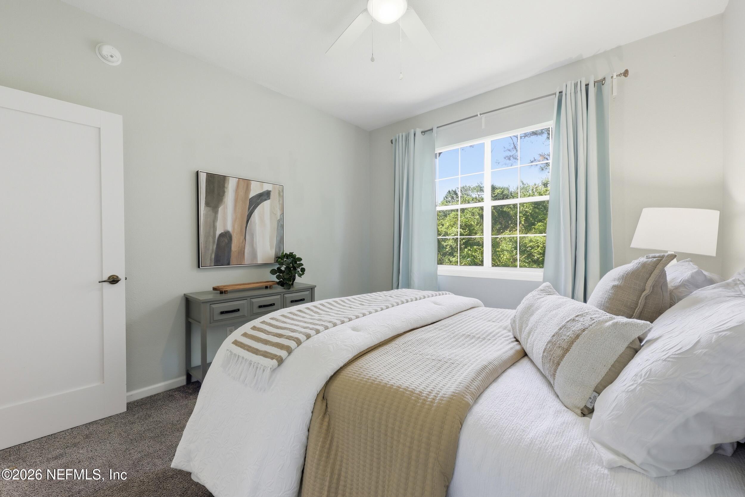 1529 Vista Cove Road St. Augustine, FL 32084 - Photo 34 of 75 a bedroom with a bed and a window